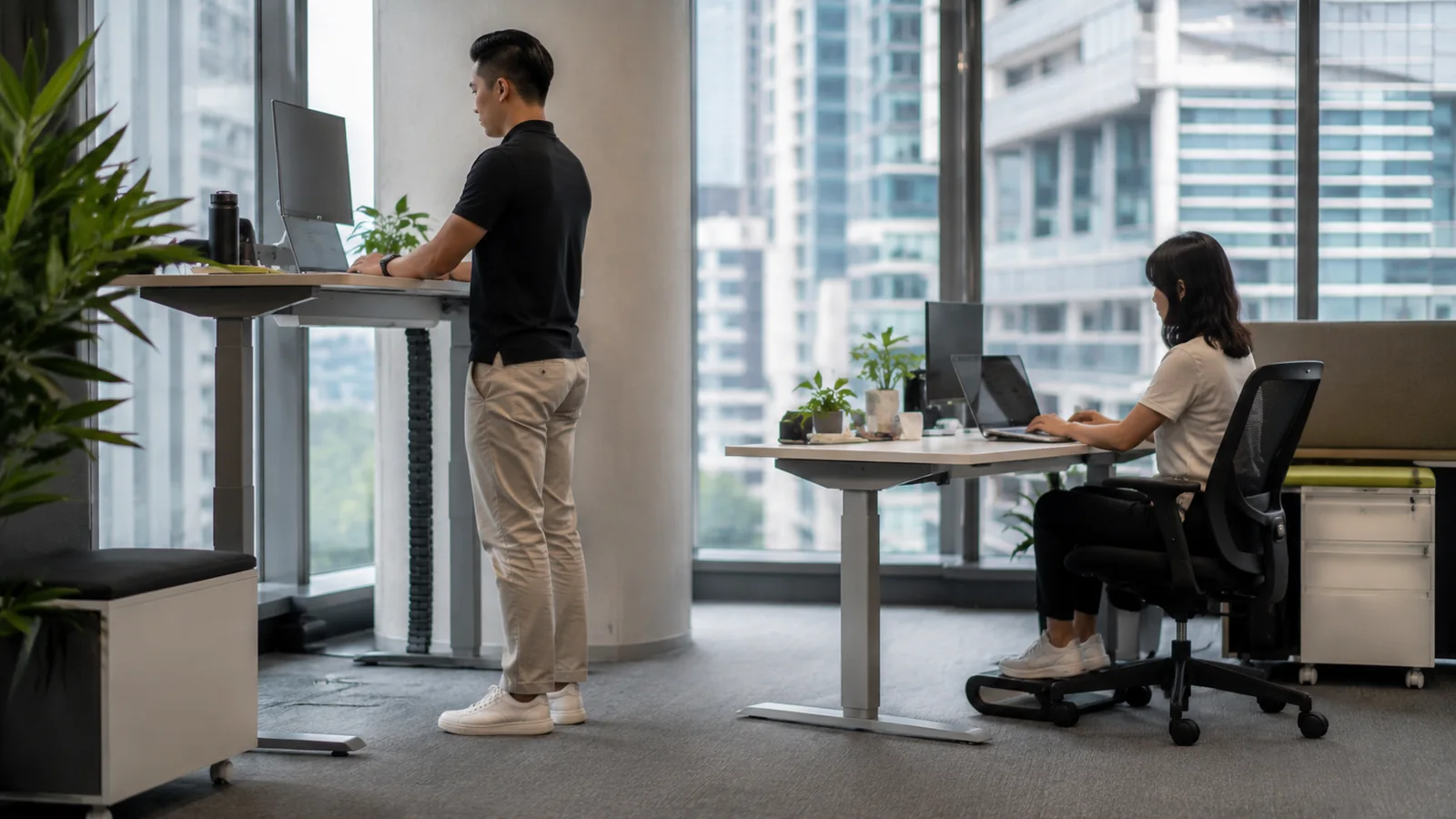 Singapore office workers using individually adjusted sitting and standing workstations