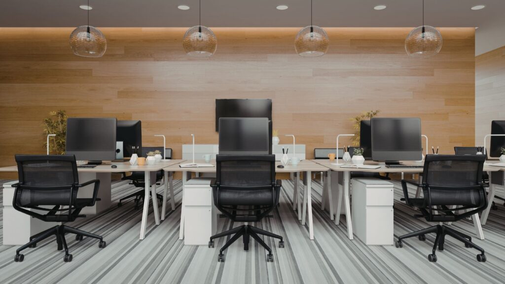 Office workstations arranged to support proper posture and ergonomic safety in a Singapore workplace