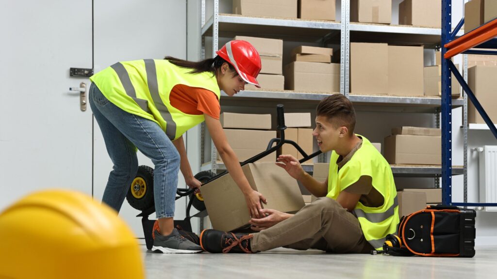 Warehouse workers responding to a workplace incident caused by unmanaged safety risks in Singapore