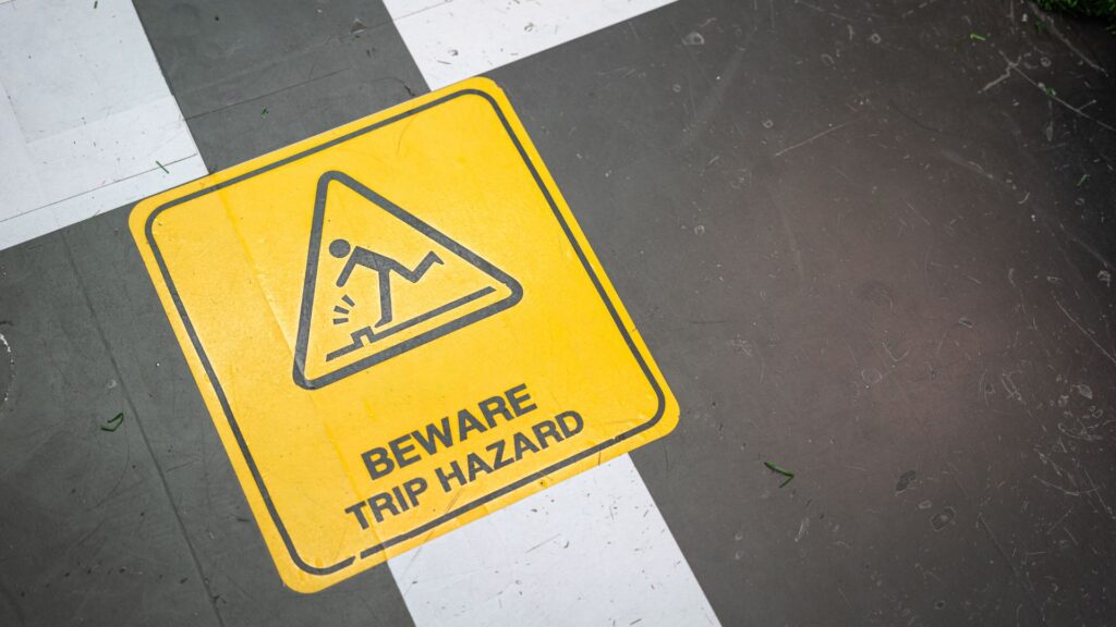 Slip, trip and fall hazard warning sign highlighting a common workplace safety risk in Singapore