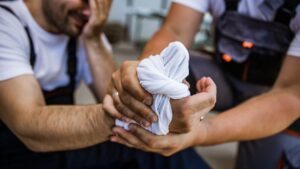 Worker receiving immediate support after a workplace injury in Singapore