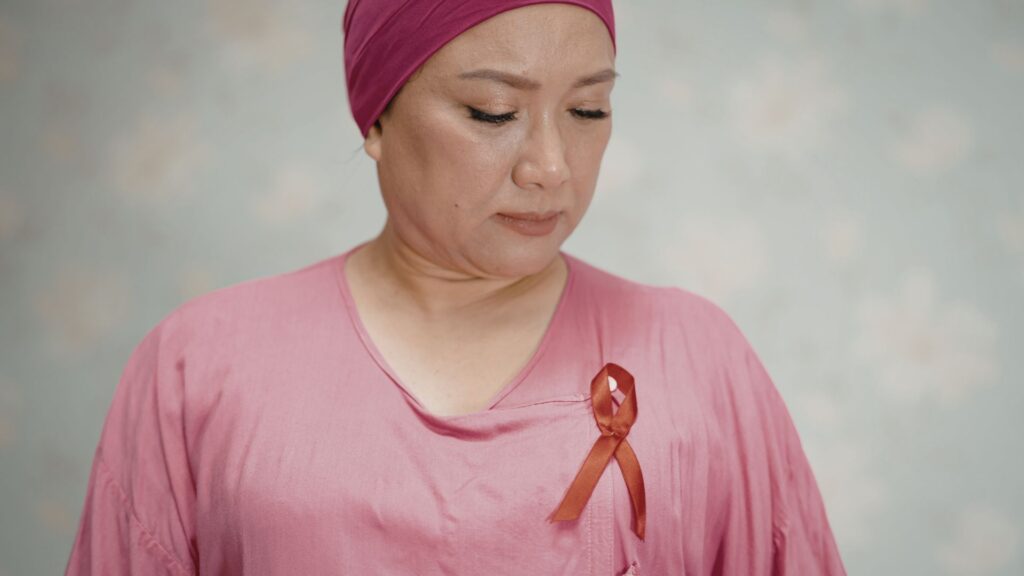 Woman wearing cancer awareness ribbon for World Cancer Day Singapore