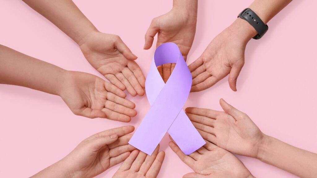 Team supporting cancer awareness with purple ribbon on World Cancer Day