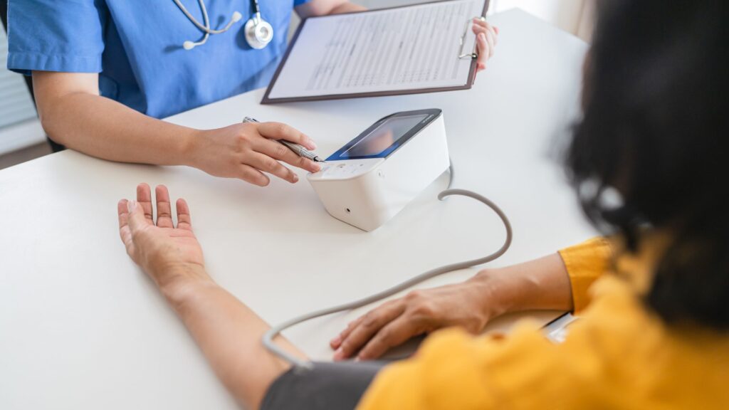 Medical team conducting on-site health screening for employees at a workplace in Singapore