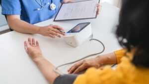 Medical team conducting on-site health screening for employees at a workplace in Singapore