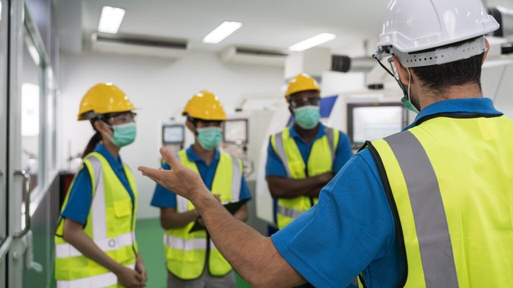 Workplace safety training briefing supporting occupational health and safety program implementation Singapore manufacturing environment