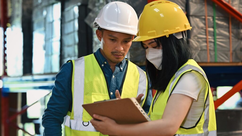 workers conducting workplace safety inspection using checklist singapore workplace safety responsibilities monitoring procedures